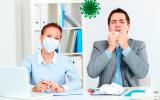 personas trabajando en una oficina con síntomas de coronavirus