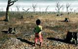 Niño pequeño en un paisaje devastado por un desastre climático