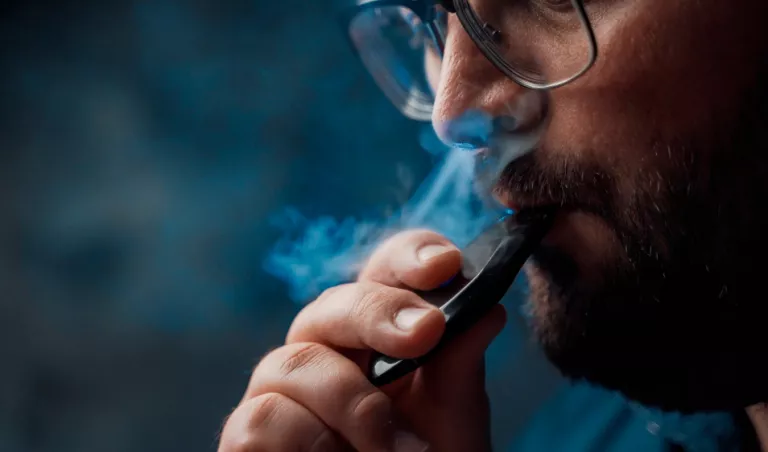 A man using a vape