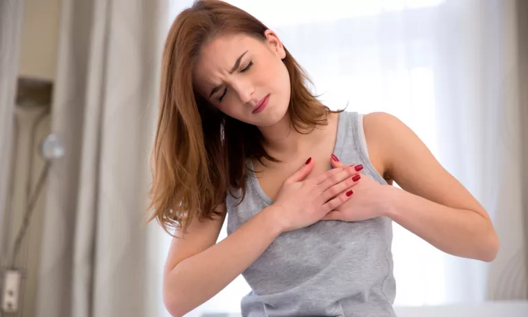 Young woman with chest pain