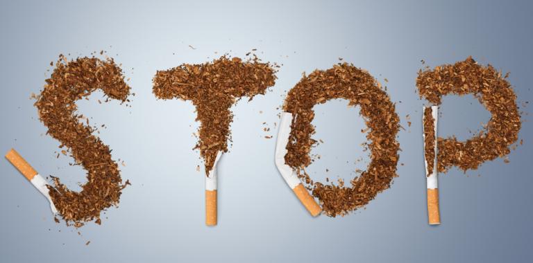 Palabra STOP formada por el tabaco picado de varios cigarrillos