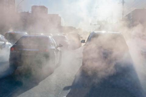 Smoke coming from vehicles in a traffic jam