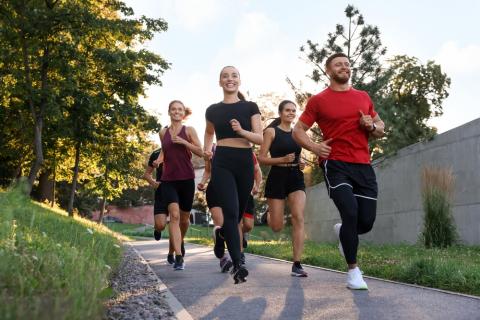 Group of people runs outdoors