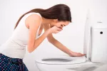 Pregorexia, la anorexia de la embarazada Mujer a punto de vomitar en el baño