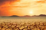 Más de mil millones de personas morirán a causa del cambio climático Paisaje anaranjado con tierra agrietada por el calor