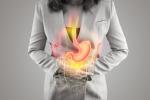 Ilustración del estómago y el intestino grueso sobre el cuerpo de una mujer